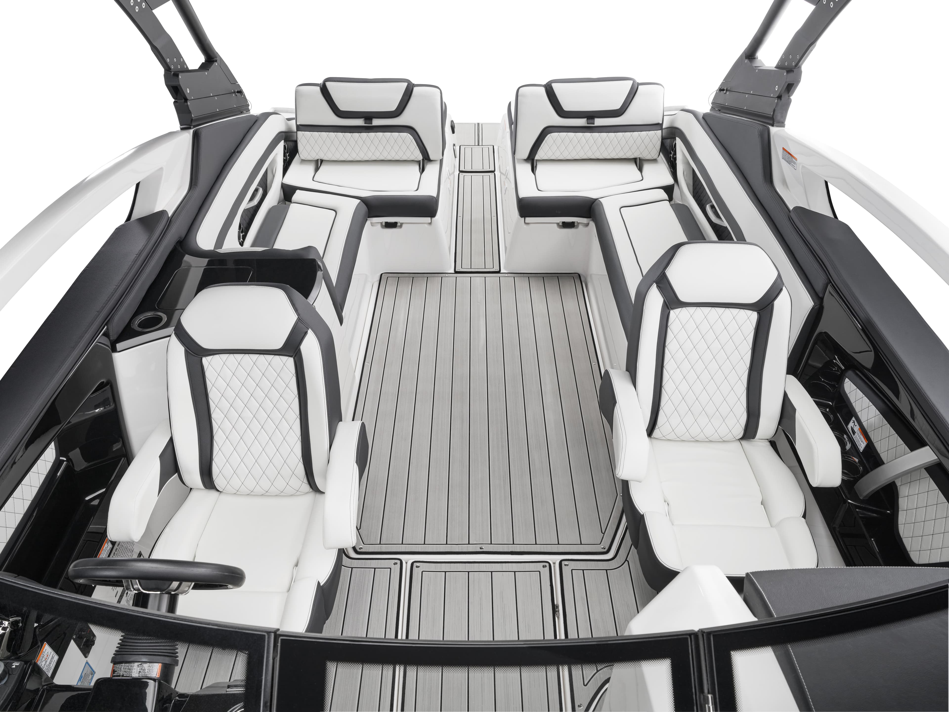 Interior cockpit view of a wakeboard boat with white and black luxury seating featuring diamond stitching